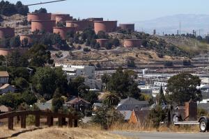 The Chevron refinery and storage tanks are seen from Crescent Avenue in Point Richmond, Calif., on Thursday, Aug. 9, 2012. (Jane Tyska/Bay Area News Group